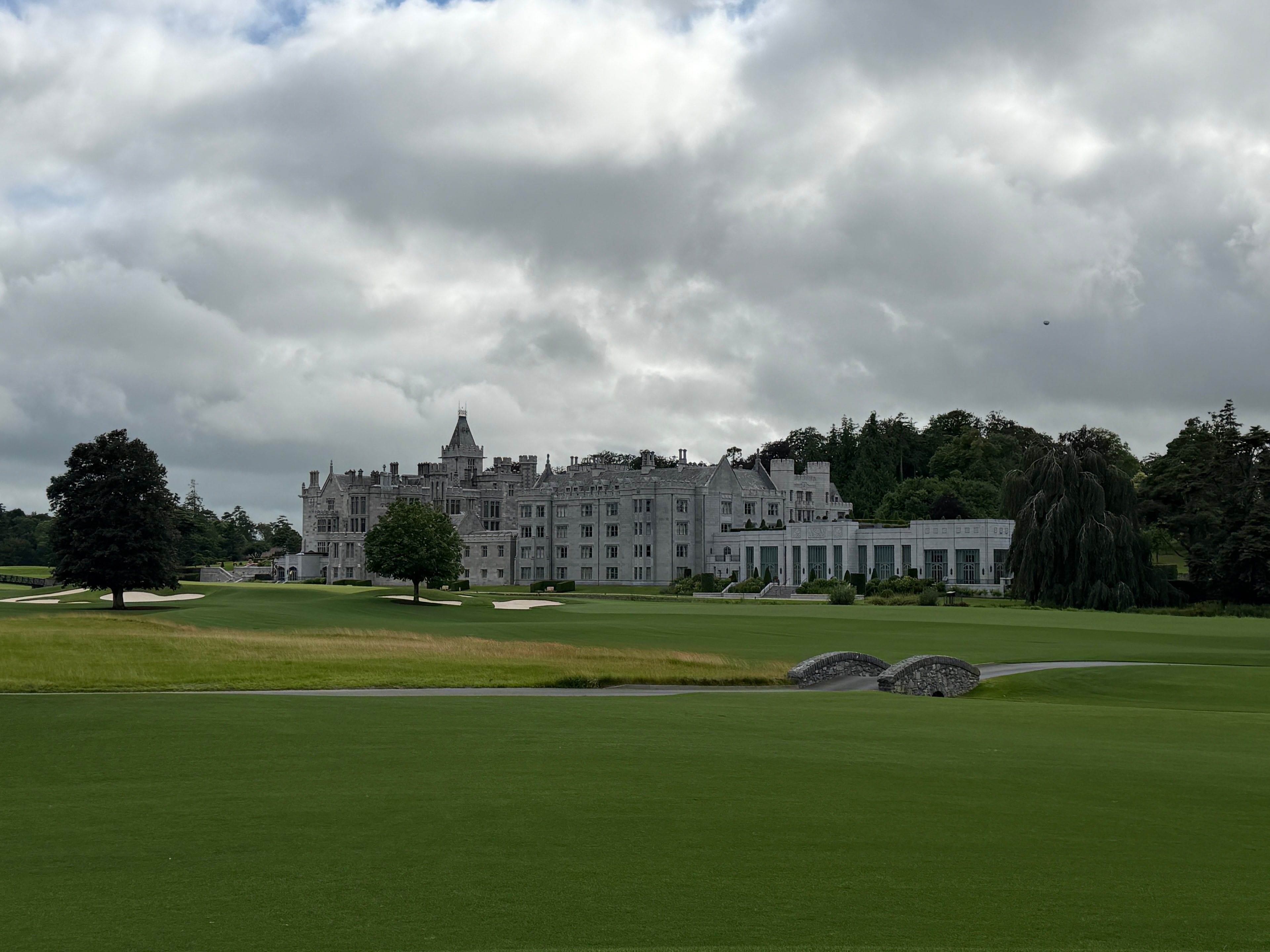 The manor rising over the fairway — Adare's Gothic Revival grandeur from the course