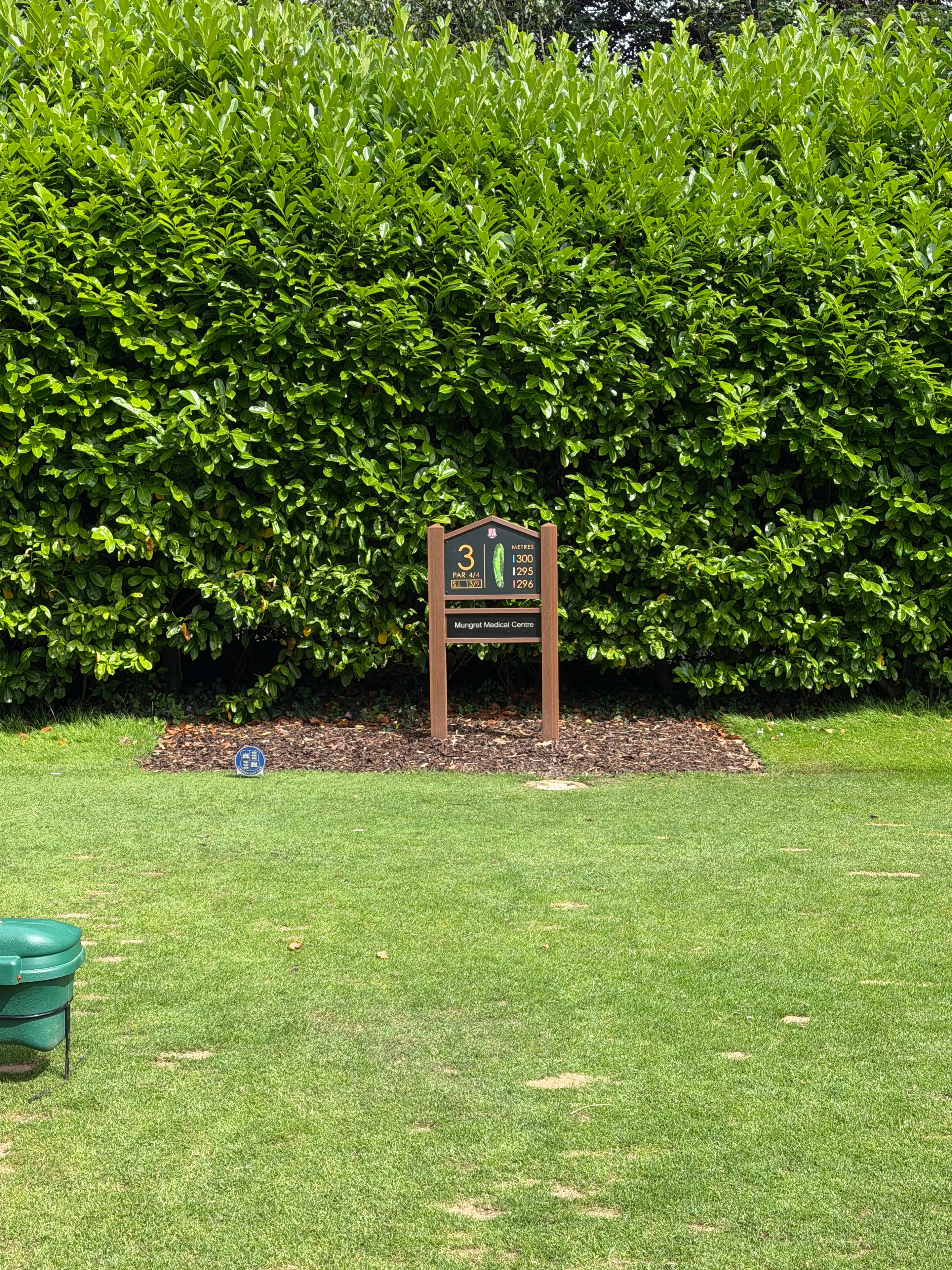 Hole 3 marker tucked beside the hedgerow at Limerick Golf Club
